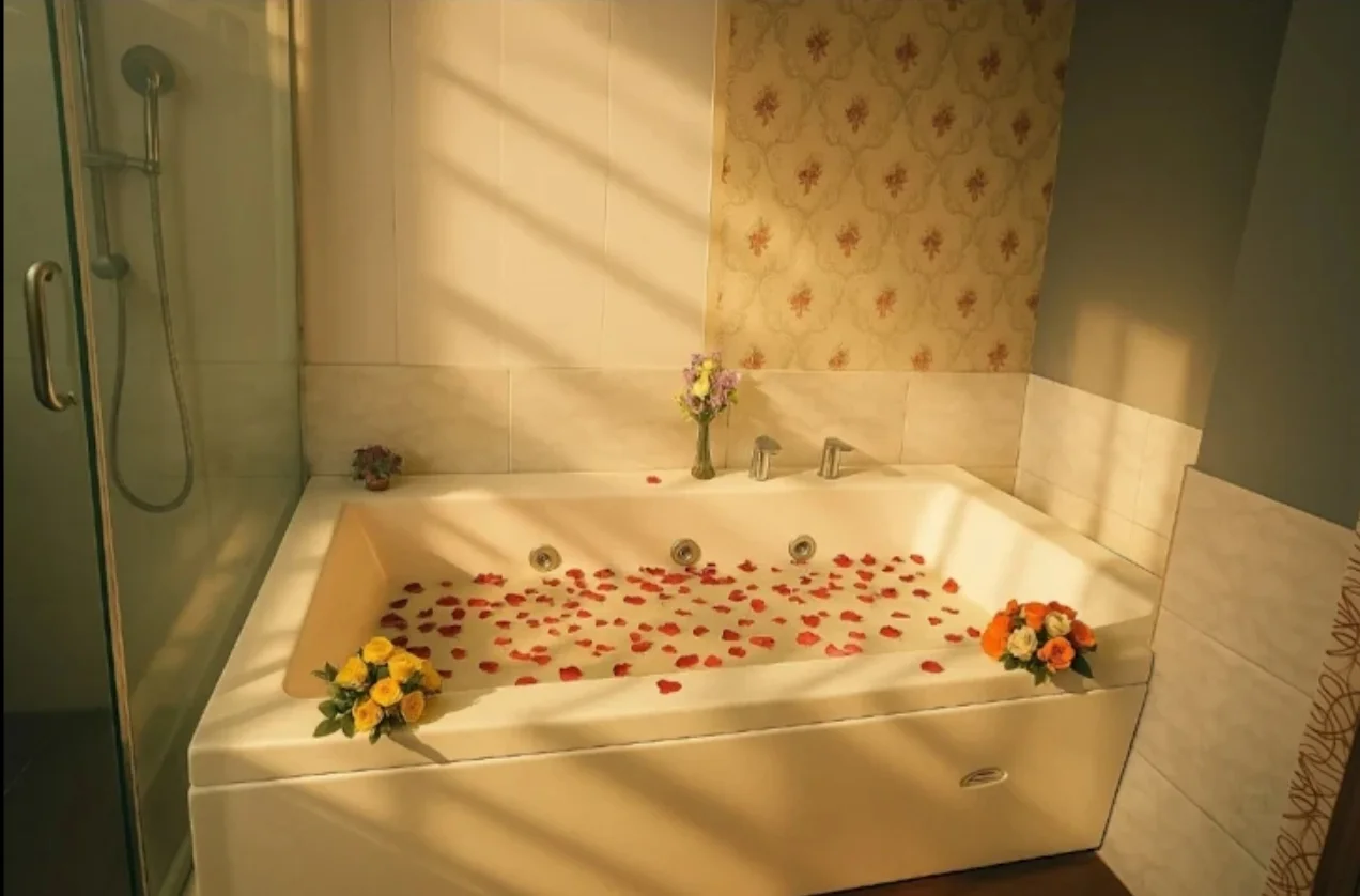Hydrotherapy Jacuzzi Bathtub with Fresh Rose Petals and Floral Arrangements at Amazing Wellness Spa Delhi