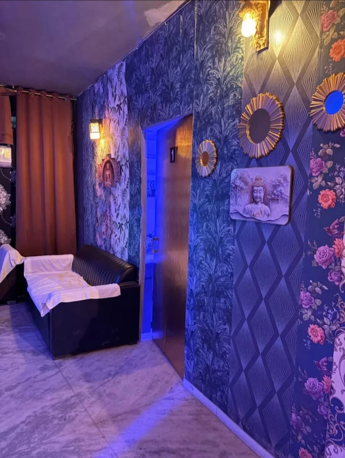 Spa Waiting Area with Leather Seating, Warm Sconces and Treatment Suite 1 at Amazing Wellness Spa
