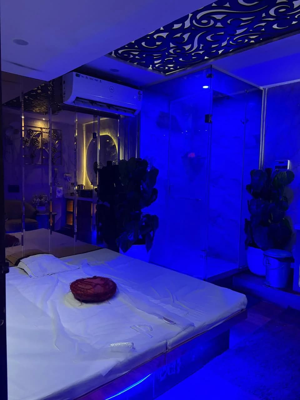 Private Therapy Room with Large Bed, Carved Ceiling and Blue Mood Lighting at Amazing Wellness Spa