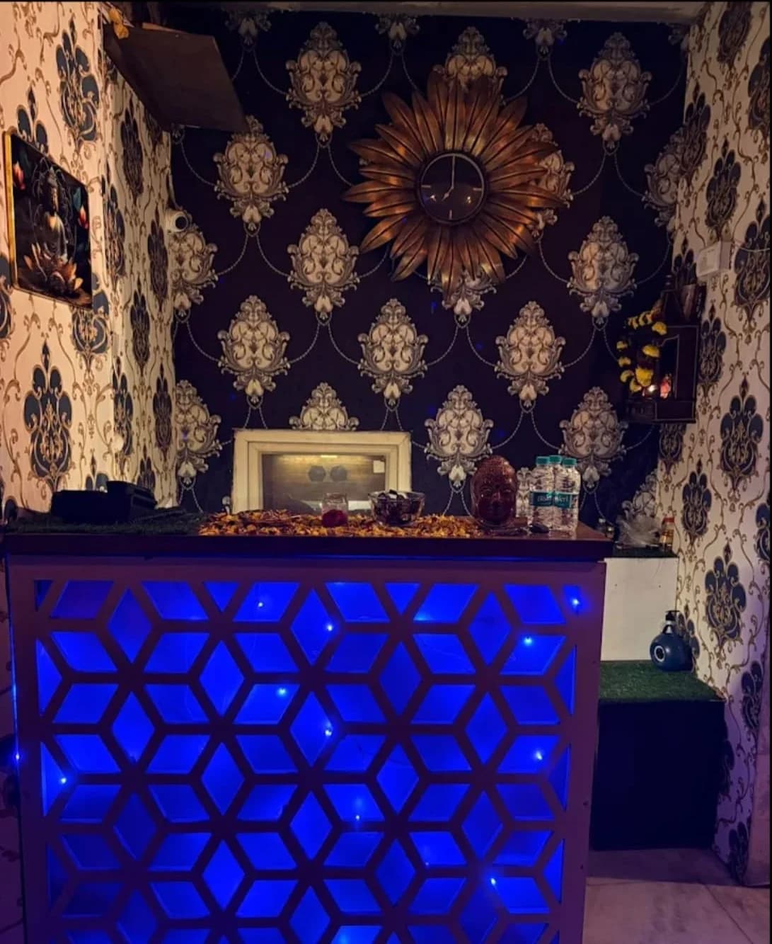 Luxury Reception Counter with Illuminated Blue Lattice and Floral Decor at Amazing Wellness Spa Lajpat Nagar 2 Delhi
